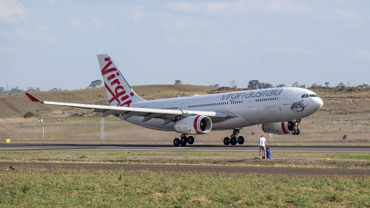 A Virgin Australia Airbus A330-200 lands at Wellcamp Airport for storage. Friday. 25th Sep 2020