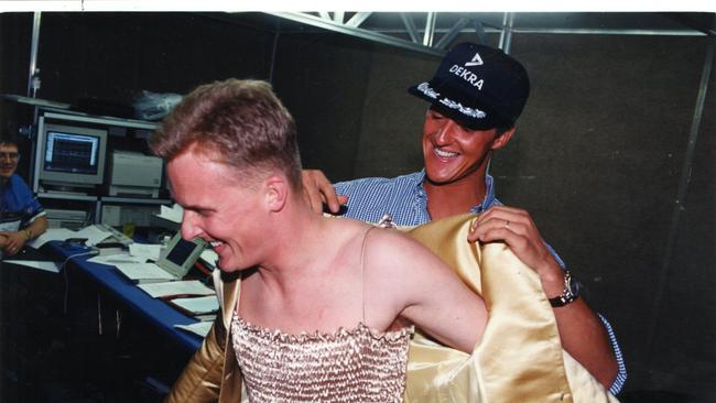 A lighthearted moment between Benetton teammates Johnny Herbert (left) and Michael Schumacher in the pits at the 1994 Australian Grand Prix. (Pic by unidentified staff photographer)