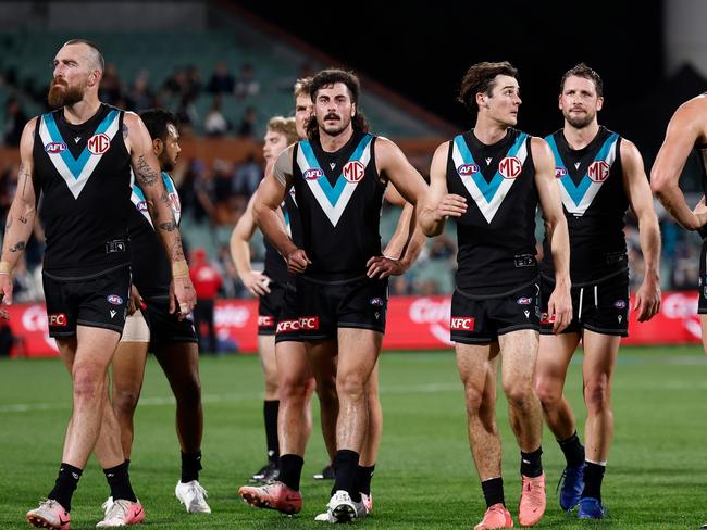 ADELAIDE, AUSTRALIA - SEPTEMBER 05: Power players look dejected after a loss during the 2024 AFL Second Qualifying Final match between the Port Adelaide Power and the Geelong Cats at Adelaide Oval on September 05, 2024 in Adelaide, Australia. (Photo by Michael Willson/AFL Photos via Getty Images)