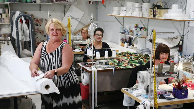 InStyle Curtains has held talks with the Queensland Government to assist in the manufacture of face masks and gowns for health workers, as the threat of coronavirus increases. Instyle Curtains co owner Janice Wicks with sewers Feleena Geddes, Peta McDowell and Noeline Gordon at the company's workshop at Bungalow. PICTURE: BRENDAN RADKE