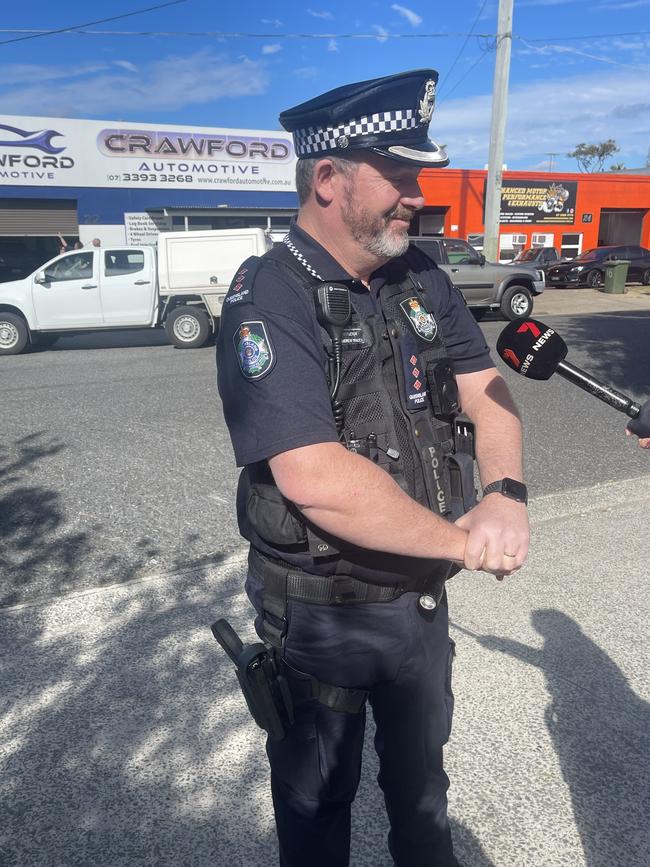 Inspector Andrew Tracey from the Brisbane Regional Unit talks to media at the scene at Wynnum workplace after a worker fell from a roof. Picture: Brayden Heslehurst