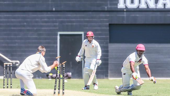 Clancy Muniandy whips the bails off playing cricket for Iona College earlier in the season – he is an under-17 Morningside footy captain who made his colts debut at the weekend.