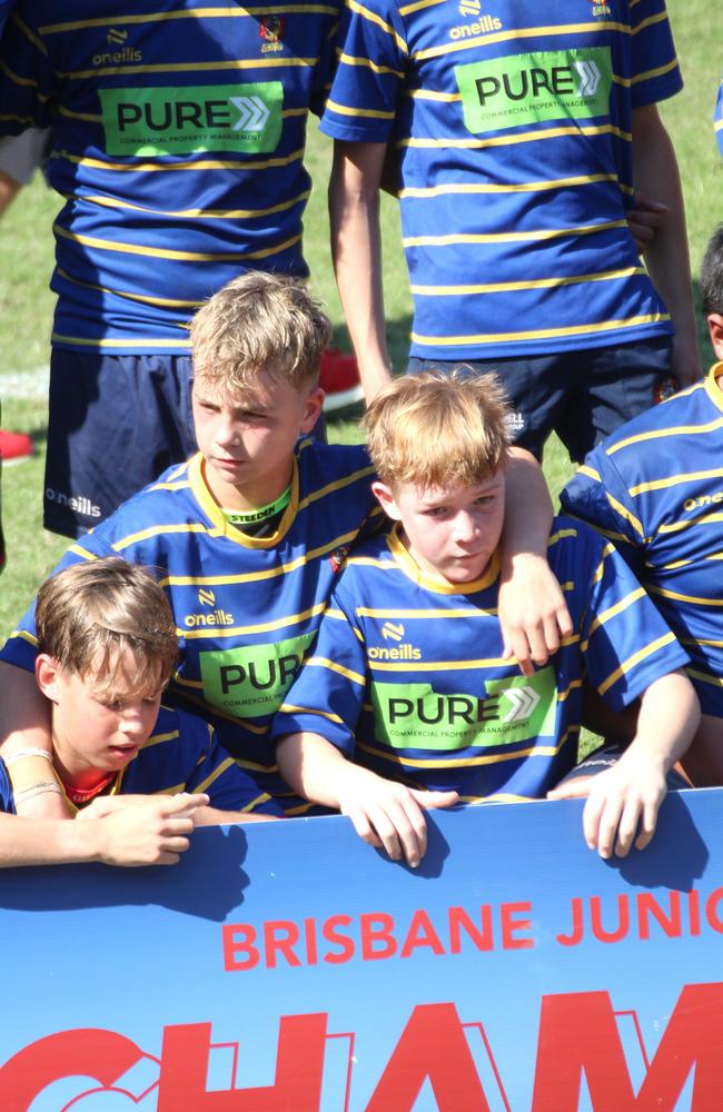 Eamon Stanbury (right) and teammates celebrate the win.