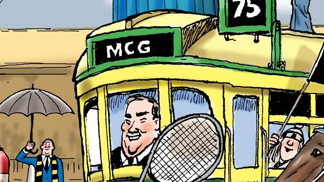 Collingwood president Eddie McGuire takes charge of a tram to the MCG.