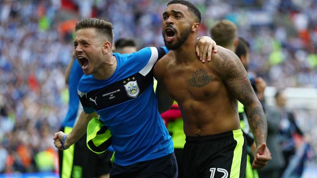 Tareiq Jolmes-Dennis of Huddersfield Town celebrates promotion.