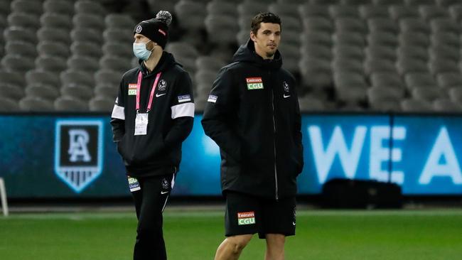 MELBOURNE, AUSTRALIA – JULY 23: Scott Pendlebury of the Magpies looks on with a bandaged leg during the 2021 AFL Round 19 match between the Port Adelaide Power and the Collingwood Magpies at Marvel Stadium on July 23, 2021 in Melbourne, Australia. (Photo by Michael Willson/AFL Photos via Getty Images)