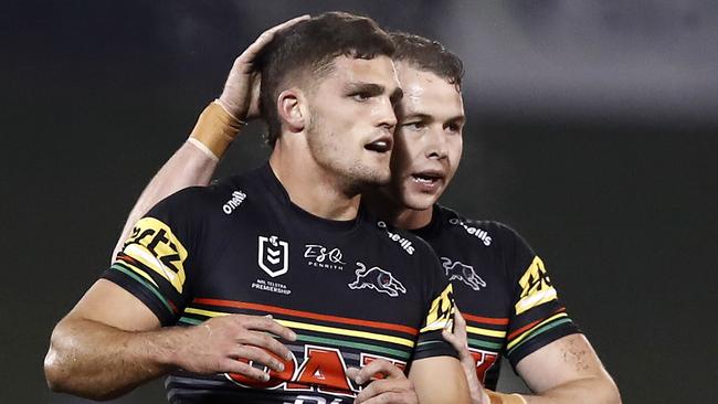 SYDNEY, AUSTRALIA - JUNE 19: Nathan Cleary of the Panthers is congratulated by teammate Dylan Edwards of the Panthers after a kick during the round six NRL match between the Penrith Panthers and the Melbourne Storm at Campbelltown Stadium on June 19, 2020 in Sydney, Australia. (Photo by Ryan Pierse/Getty Images)