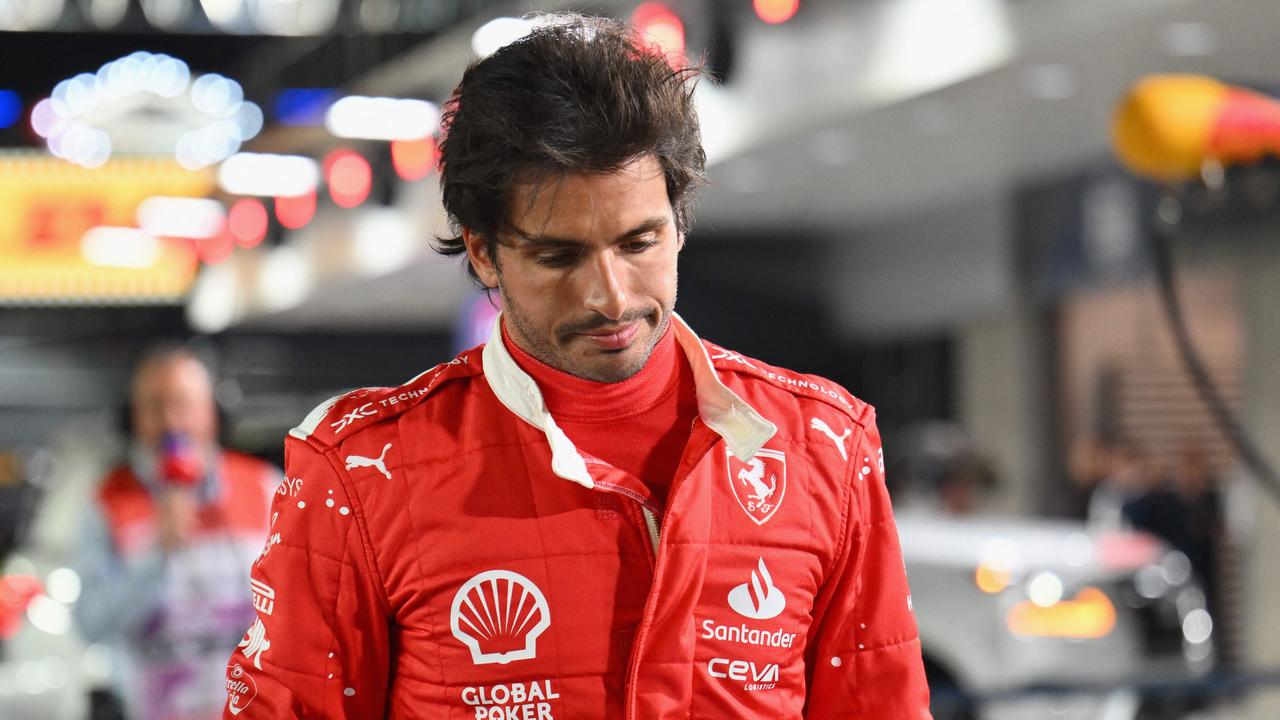 Ferrari's Spanish driver Carlos Sainz Jr., returns to the pit after an accident during the first practice session for the Las Vegas Formula One Grand Prix on November 16, 2023, in Las Vegas, Nevada. The Las Vegas Grand Prix got off to an embarrassing start after the first practice session on the new circuit was cut short after around 10 minutes on Thursday due to a loose drain cover which Sainz hit during the session. (Photo by ANGELA WEISS / AFP)