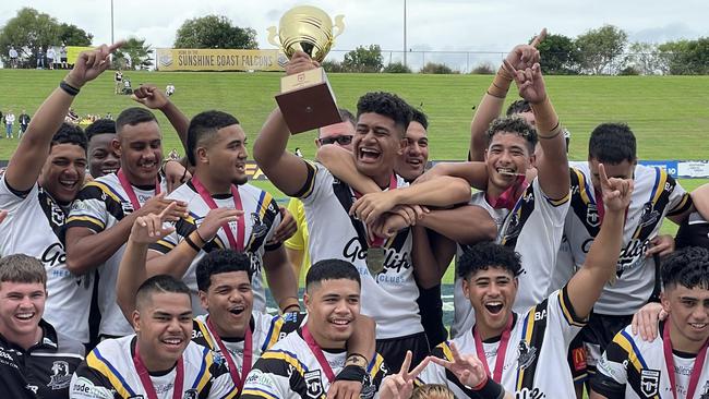 Happy days for Souths Logan captain Ahmani Leilua, with cup, and teammates.