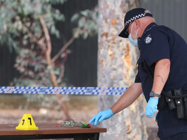 Police gather evidence at the scene. Picture: Brendan Beckett