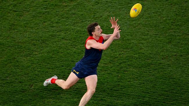 Jake Lever marks the ball on Friday night. Picture: Morgan Hancock/AFL Photos via Getty Images