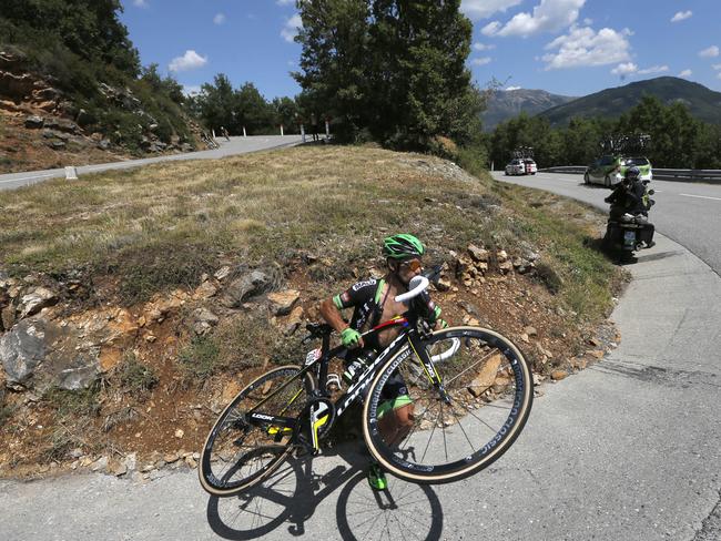 Armindo Fonseca of France gets back on the road after going straight into the grass when arriving to fast in a hairpin turn in a downhill during the seventeenth stage of the Tour de France.