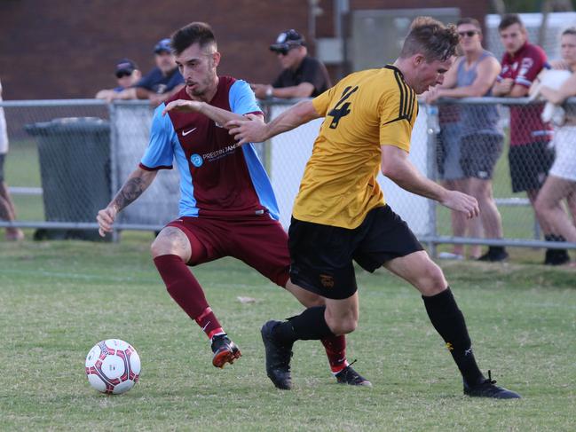 Coomera’s Daniel Abreu turns Mudgeeraba’s Matt Hibbs inside out at Viney Park on Sunday. Picture: Mike Batterham