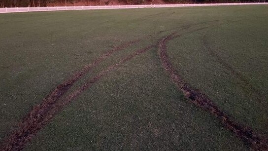 Vandals left huge tyre tracks in the Helensvale Pacific Pines cricket field on Wednesday morning. Picture: Supplied