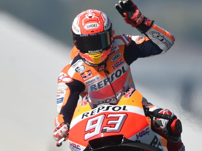 Repsol Honda Team's Spanish rider Marc Marquez waves as he clocked the best time of the warm-up ahead of the French motorcycling Grand Prix on May 20, 2018 in Le Mans, northwestern France.  / AFP PHOTO / JEAN-FRANCOIS MONIER