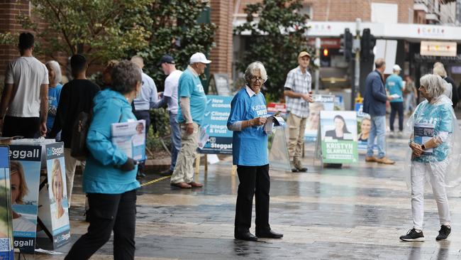 A photo of Katherine Deves talking to voters on election day