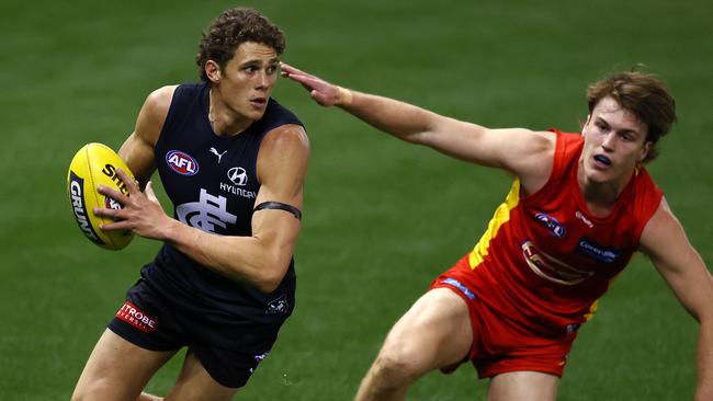 Charlie Curnow breaks away from Gold Coast’s Charlie Ballard at Marvel Stadium on Saturday. The loss put pressure on Blues coach David Teague. Picture: Michael Klein