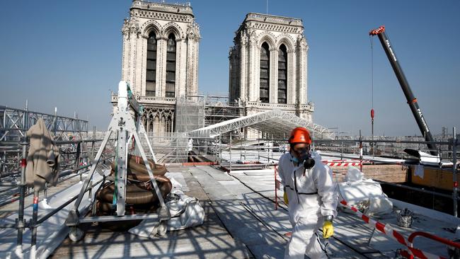 A worker walks on the roof of the Notre-Dame de Paris Cathedral on April 15, 2021. Two years after the fire, the actual restoration work had yet to begin as time up until then had been spent on securing the building. Picture: Benoit Tessier/Pool/AFP