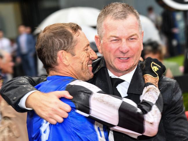 MELBOURNE, AUSTRALIA - MARCH 13: Trainer Kris Lees and Hugh Bowman celebrate after Mugatoo won Race 8, the All-star Mile, during Melbourne Racing All-Star Mile Day at Moonee Valley Racecourse on March 13, 2021 in Melbourne, Australia. (Photo by Vince Caligiuri/Getty Images)