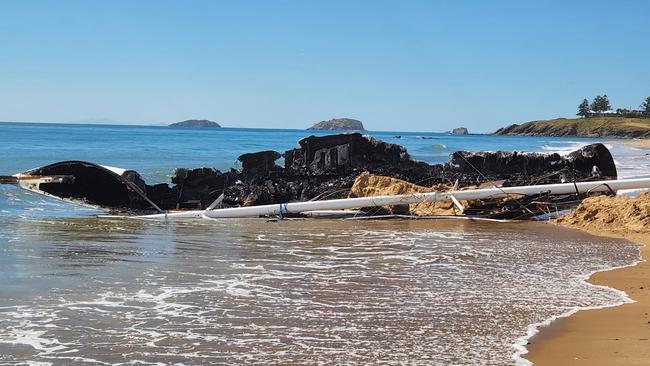 The burnt remains of the 15.2m yacht, Scoundrel, on Main Beach, Emu Park, on November 25, 2022. Photo: Darryn Nufer.