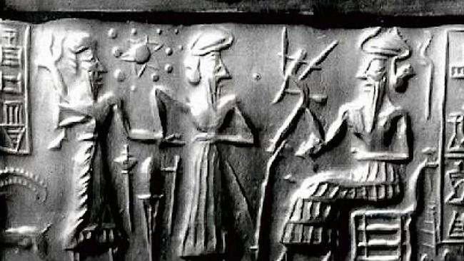 Part of an ancient Sumerian tablet conspiracy theorists say shows 'wise men' examining the movements of a 'death planet'.