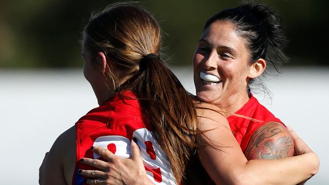 Eden Zanker and Tegan Cunningham celebrate a goal during Melbourne’s win. Picture: AFL Media 