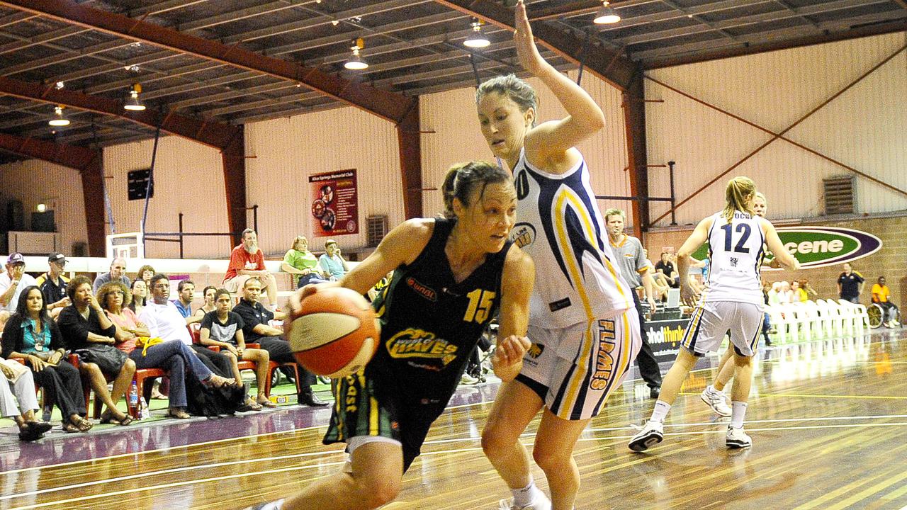 Main season WNBL fixture between West Coast Waves (WA team) and Sydney Uni Flames at Alice Springs Basketball stadium. Tully Bevilaqua heads for the hoop as she by passes Uni Flames Katie Ebzery