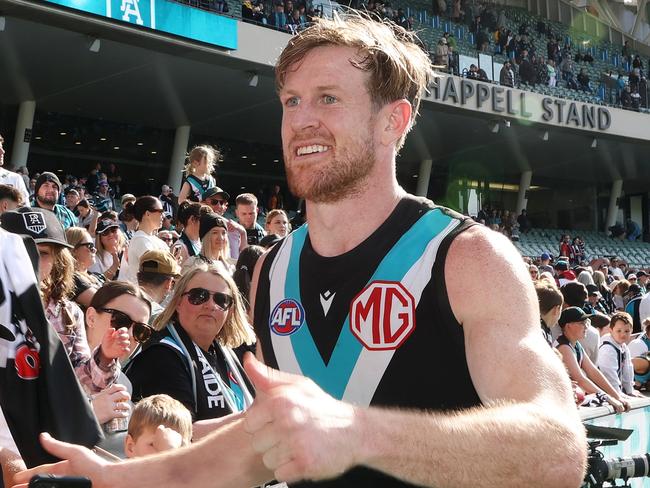 ADELAIDE, AUSTRALIA - AUGUST 27: Tom Jonas of the Power with fans after the win during the 2023 AFL Round 24 match between the Port Adelaide Power and the Richmond Tigers at Adelaide Oval on August 27, 2023 in Adelaide, Australia. (Photo by Sarah Reed/AFL Photos via Getty Images)
