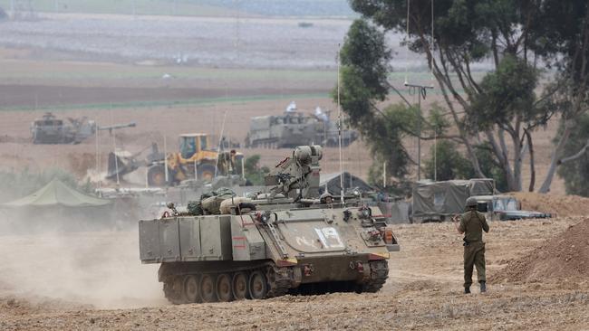 Israeli troop enforcements take position on the border with Gaza in southern Israel.