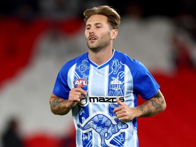 MELBOURNE, AUSTRALIA - MAY 01: Caleb Daniel of the Kangaroos warms up ahead of his 200th game during the round eight AFL match between Essendon Bombers and North Melbourne Kangaroos at Marvel Stadium, on May 01, 2025, in Melbourne, Australia. (Photo by Josh Chadwick/Getty Images)
