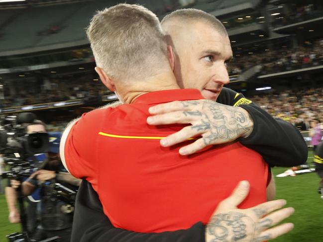 MELBOURNE, AUSTRALIA - AUGUST 24:  Dustin Martin of the Tigers and Damien Hardwick, Senior Coach of the Suns embrace after during the round 24 AFL match between Richmond Tigers and Gold Coast Suns at Melbourne Cricket Ground, on August 24, 2024, in Melbourne, Australia. (Photo by Darrian Traynor/Getty Images)