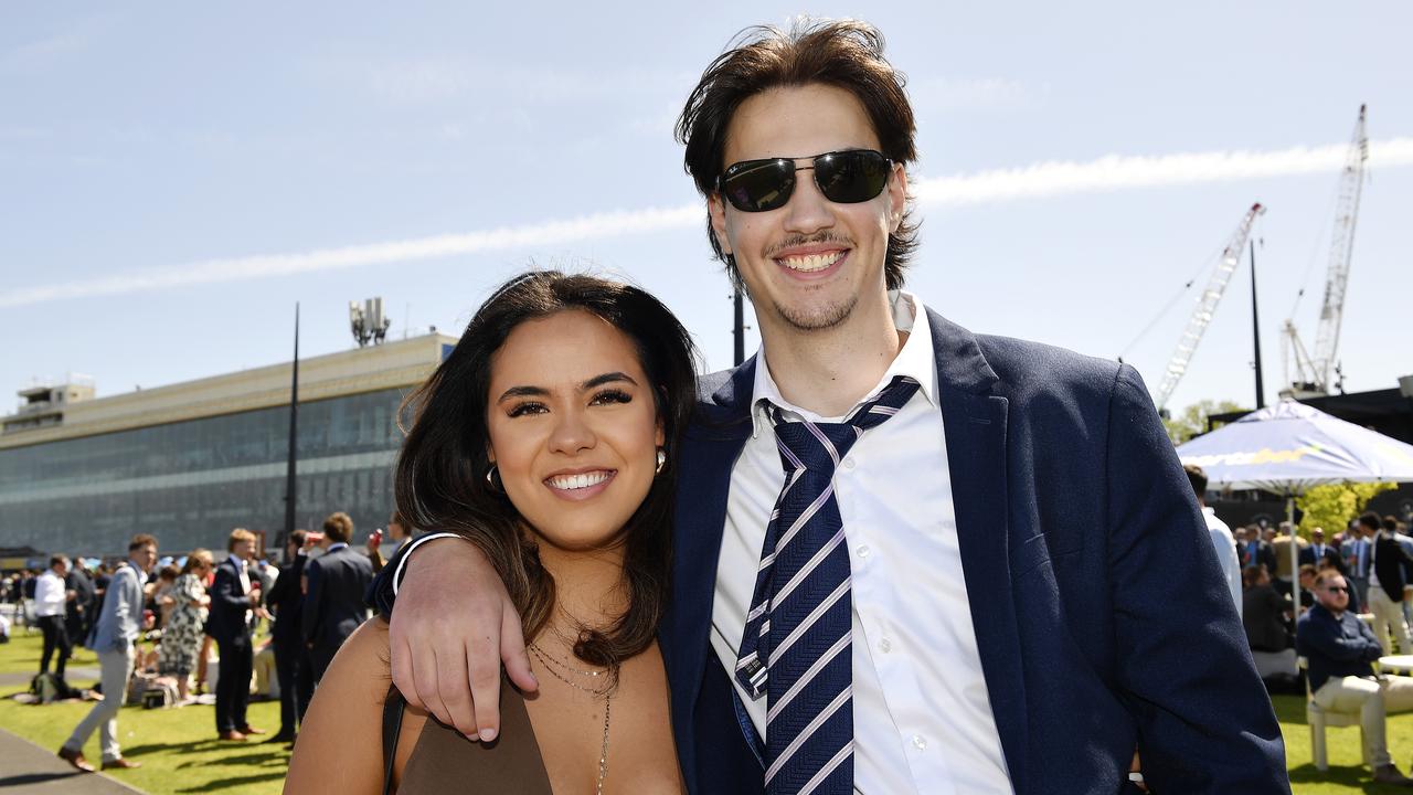 Caulfield Guineas horse race meeting, Caulfield, Victoria, Saturday 12th October 2024. Faces in the crowd. Pictured enjoying the race meeting are Angel and Harrison. Picture: Andrew Batsch