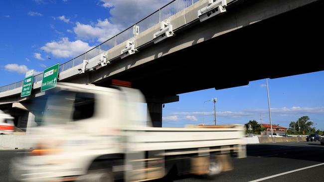 The fines are not just for anti-social drivers caught speeding. There are fines for littering and weapons offences. There are court-ordered fines and compensation orders. Above, speed cameras on the underside of the bridge at the Ipswich Motorway turn-off. Photo: Adam Head