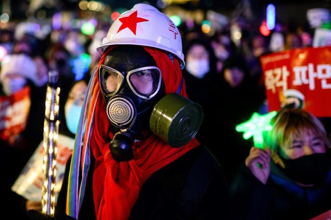 Protesters march as they take part in a demonstration against impeached South Korean President Yoon Suk Yeol