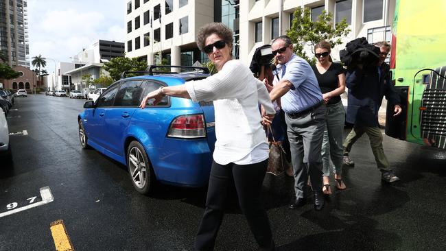 The woman leads Kenneth Stanley away from Southport Courthouse. Photograph: Jason O'Brien