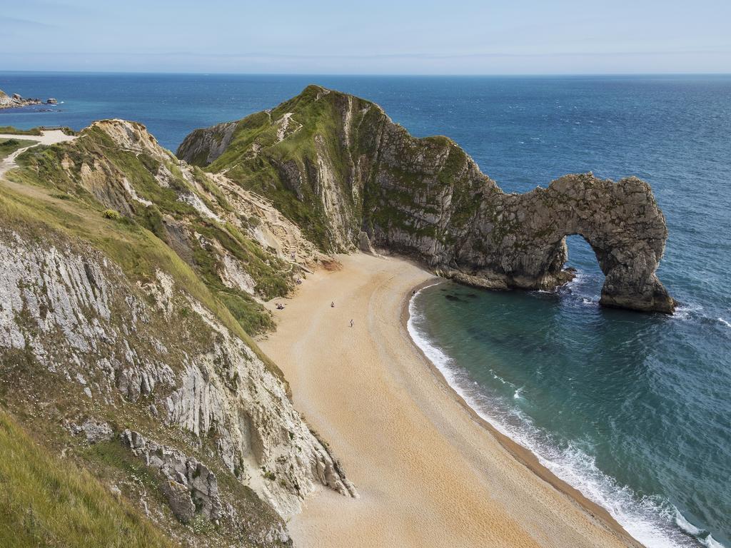 Man blasted for using jet pack to fly through arch at Durdle Door beach ...