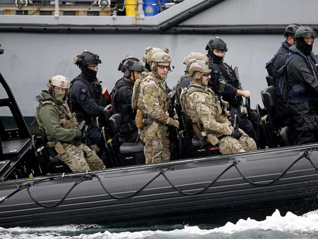 SYDNEY, AUSTRALIA - NewsWire Photos  SEPTEMBER 26, 2024:  Military and police personnel board the HMAS Gascoyne as part of boarding exercises. Personnel from Australian Defence Force, Japan, Republic of Korea and the United States as well as the Australian Federal Police and New South Wales Police Force work together in ship boarding exercises and training as part of Exercise Pacific Protector.   Picture: NewsWire / John Appleyard