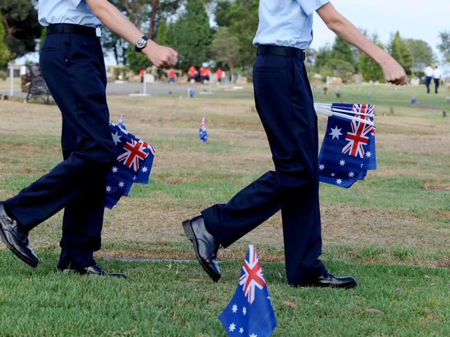 On Australia Day, Castle Hill sub-branch members and families plant an Australian flag next to the graves of veterans.Cadets from 336 Squadron, Richmond help with the planting.