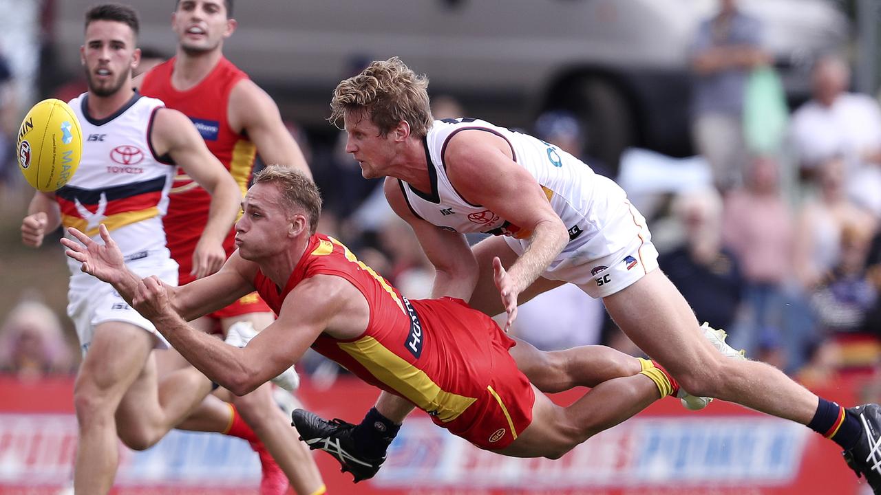 Rory Sloane tackles Gold Coast’s Will Brodie during the Marsh Community Series. Picture: Sarah Reed.