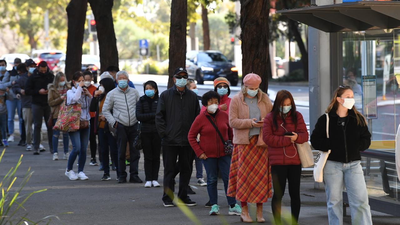 People queue to receive the Covid-19 vaccine at Sydney Olympic Park. Picture: James D. Morgan/Getty Images