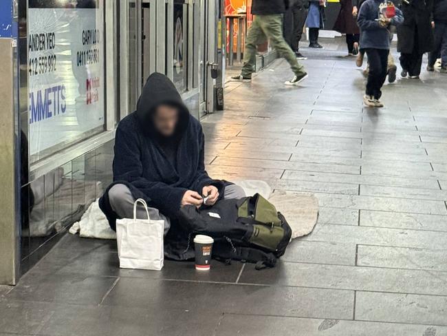 A man settles in for the night on Degraves St. Picture: Supplied