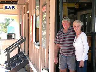 Publicans Bernie and Debbie Kerr serve their last drinks at the Linville Hotel after nearly 36 years in the business. Picture: Contributed