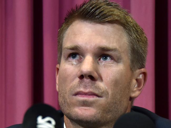 TOPSHOT - Australian cricketer David Warner listens to a question at a press conference at the Sydney Cricket Ground (SCG)  in Sydney on March 31, 2018, after returning from South Africa. Former Australia vice-captain David Warner apologised in tears on March 31 for his role in a ball-tampering scandal and said he would weigh up an appeal against his 12-month ban. / AFP PHOTO / PETER PARKS / -- IMAGE RESTRICTED TO EDITORIAL USE - STRICTLY NO COMMERCIAL USE --