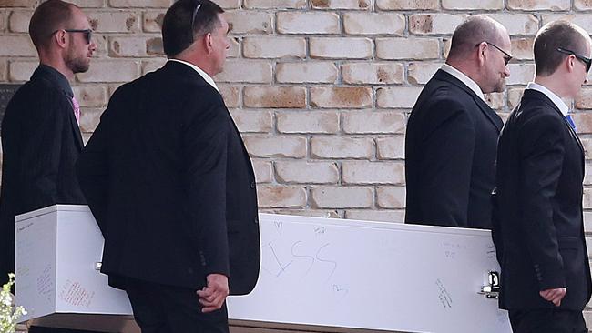 The funeral of Larissa Beilby, with her father Peter (second from right) and brother Nathan (left) carry her casket. Picture: Jono Searle