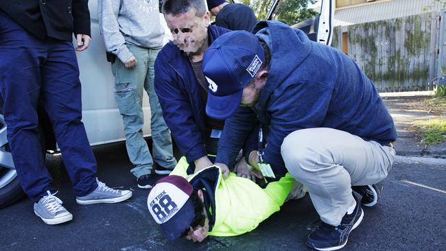 Police arrest a man connected with a large hydroponic cannabis set up in Brookvale. Picture: Braden Fastier