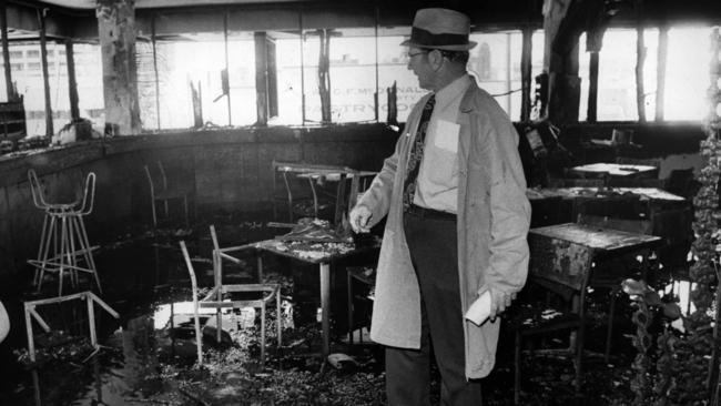 Police inspect the damage at the Whiskey Au-Go-Go nightclub in Fortitude Valley, Brisbane, after the 1973 firebombing.