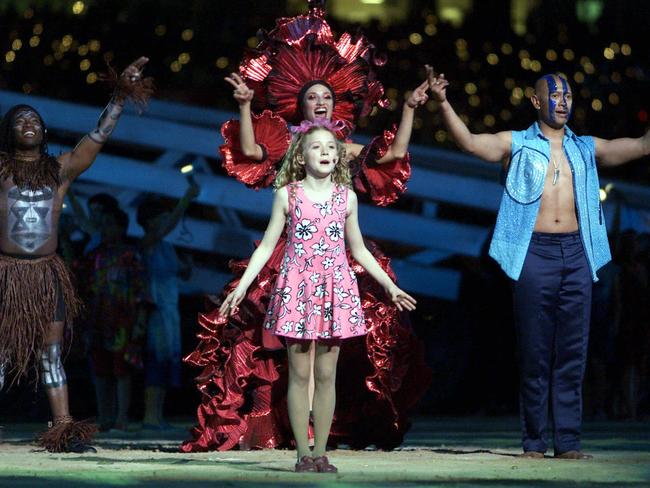 Nikki Webster performing with Aboriginal dancers during the Sydney Olympic Games opening ceremony at Stadium Australia, Homebush, 2000. Picture: Jeff Darmanin