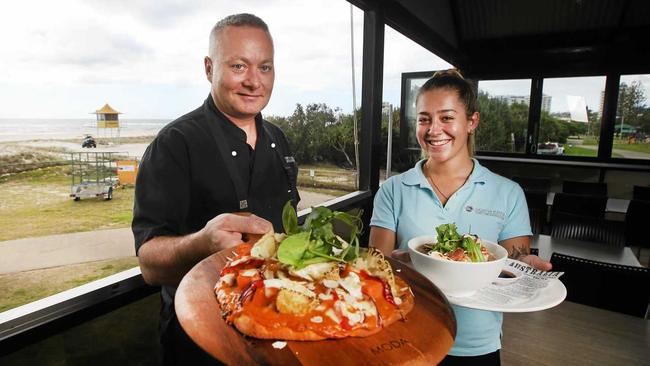 FINE FOOD: North Kirra Surf Life Saving Club head Chef Bernie Powling and staff member Brianna Buvnett. Picture: Scott Powick