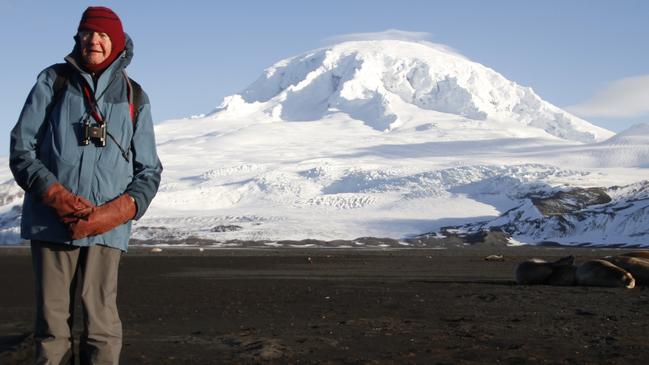 Dr Grahame Budd and Big Ben, Australia’s highest peak at 2835 metres, on Heard Island. Dr Budd was part of a team that made the first ascent in 1965 after almost losing his life on the mountain two years earlier. Picture: Michael Dillon 2012