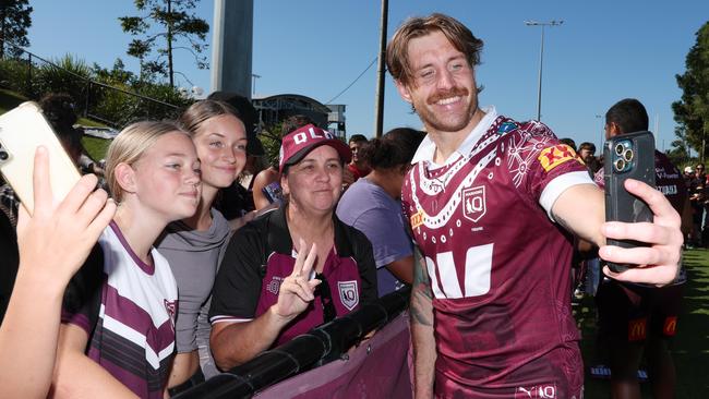 Cameron Munster takes a selfie with Queensland fans. Picture Lachie Millard